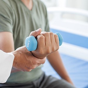 Patient undergoing physical therapy for their hand