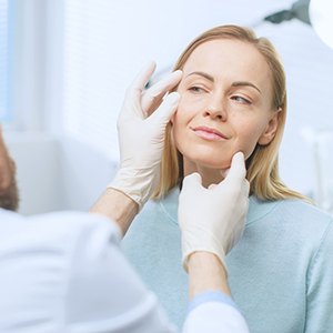 Woman attending plastic surgery consultation